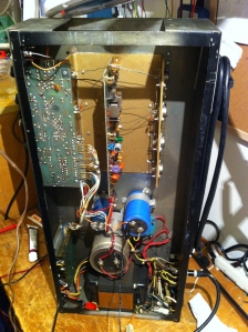 Huge power transformer down below, preamp board on the top left, power amp board in the rear (bottom) of the chassis and connected to output transistors and large gold heat sink, and three massive can-style electrolytic capacitors in the middle. Biggest cap (silver) powers the power amp, top left can cap (smallest one) goes to the preamp, and the one on the right couples the power amp to the speaker, blocking the DC power amp voltage and passing only the AC signal voltage to the speaker jack.  If you look close you can see the purple circular trimpot on the power amp board towards the lower half of the PCB. It is slotted so you can turn it with a screwdriver. This is the symmetrical clipping offset adjustment (R304 on the schematic). It's used to adjust the DC voltage on the capacitor connected to the speaker jack to HALF the power amp supply voltage. In this case the power supply voltage 86.6V. Even when cranking the trimpot all the way the lowest voltage within reach was 51.2V. A check of the resistors in the circuit revealed some drifted ones that needed to be replaced. For instance R303, a 180K resistor connected directly to R304 trimpot measured 223K.  The previous picture shows the amp after repair powered on at idle with multimeter displaying voltage at the cap coupling power amp to speaker jack. Not exactly half but i got the most symmetrical clipping IMO with 43.8VDC.